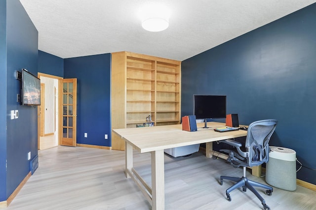 18715 24th Ave N, Plymouth, MN 55447 - office area featuring baseboards, wood finished floors, a textured ceiling, and built in features