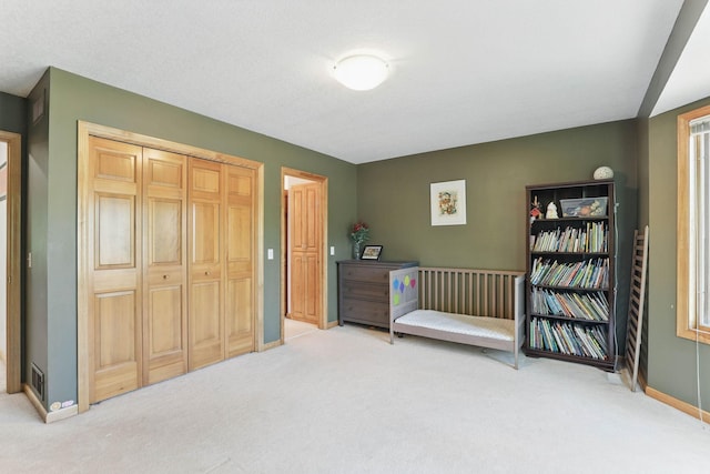 18715 24th Ave N, Plymouth, MN 55447 - bedroom with carpet flooring, baseboards, and a closet