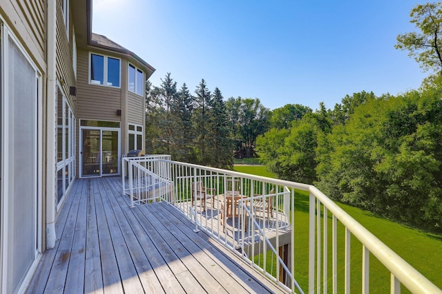 18715 24th Ave N, Plymouth, MN 55447 - wooden deck featuring a yard and view of wooded area