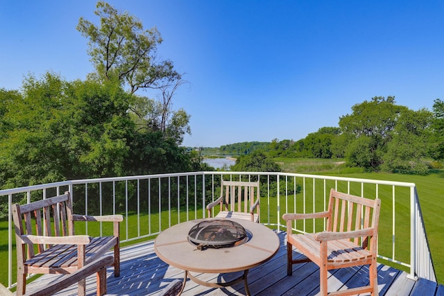 18715 24th Ave N, Plymouth, MN 55447 - deck with a fire pit, a water view, and a lawn