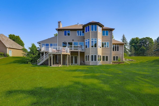 18715 24th Ave N, Plymouth, MN 55447 - rear view of property with a chimney, a deck, a yard, and stairway