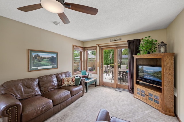 9452 Stevens Ave S, Bloomington, MN 55420 - carpeted living room with a textured ceiling and a ceiling fan