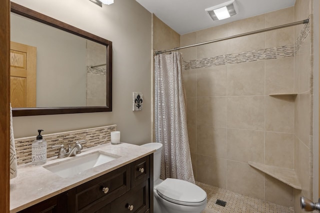 9452 Stevens Ave S, Bloomington, MN 55420 - bathroom featuring toilet, vanity, backsplash, and tiled shower