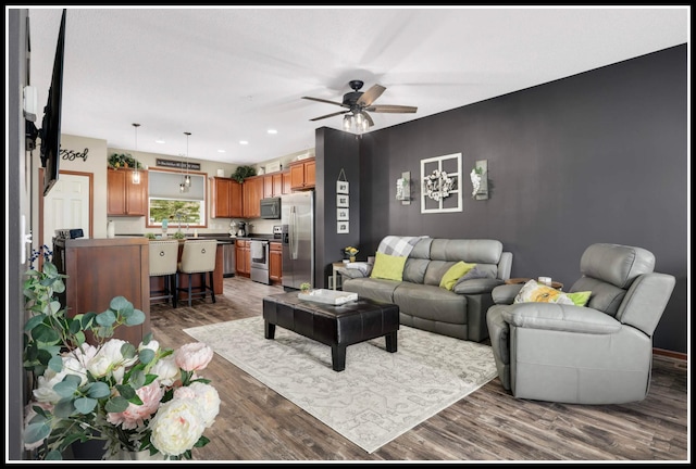 8065 Kirkwood Ln N Unit 82, Maple Grove, MN 55369 - living room with wood finished floors, a ceiling fan, and recessed lighting