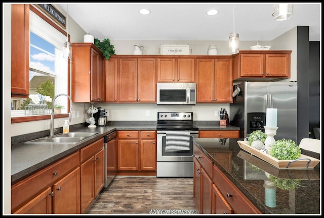 8065 Kirkwood Ln N Unit 82, Maple Grove, MN 55369 - kitchen with appliances with stainless steel finishes, dark wood-style floors, brown cabinetry, hanging light fixtures, and recessed lighting