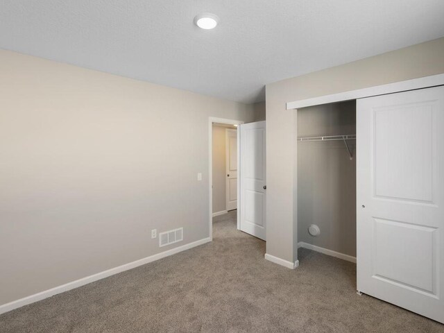 6720 376th St, North Branch, MN 55056 - unfurnished bedroom with light carpet, baseboards, and a closet