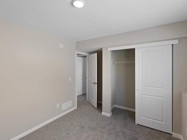 6720 376th St, North Branch, MN 55056 - unfurnished bedroom with carpet, baseboards, a closet, and a textured ceiling