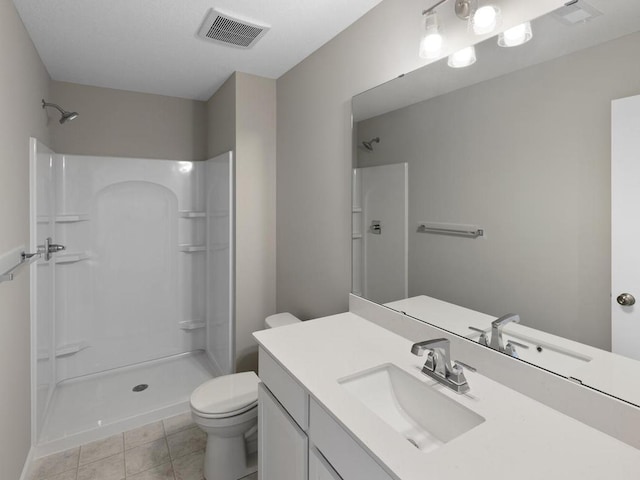 6720 376th St, North Branch, MN 55056 - bathroom with toilet, a shower, vanity, and tile patterned flooring