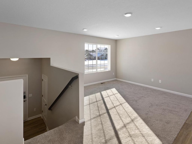 6720 376th St, North Branch, MN 55056 - unfurnished living room with baseboards, carpet, and recessed lighting