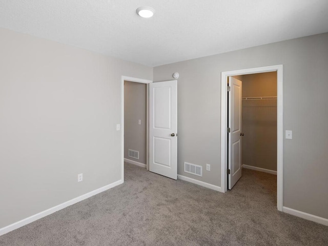 6720 376th St, North Branch, MN 55056 - unfurnished bedroom featuring carpet floors, a spacious closet, baseboards, and a closet