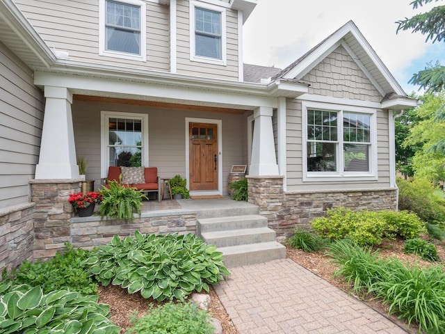 1776 Lockridge Ct, Waconia, MN 55387 - view of exterior entry with a porch and stone siding