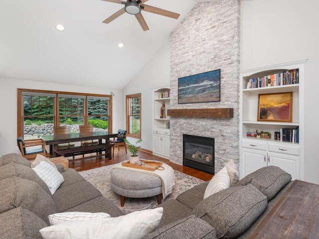 1776 Lockridge Ct, Waconia, MN 55387 - living area featuring wood finished floors, high vaulted ceiling, a ceiling fan, a stone fireplace, and built in shelves