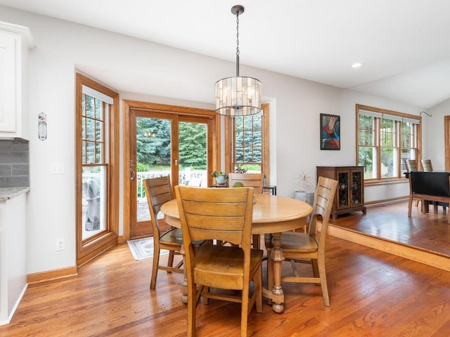 1776 Lockridge Ct, Waconia, MN 55387 - dining space with light wood finished floors, a chandelier, baseboards, and recessed lighting