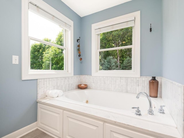 1776 Lockridge Ct, Waconia, MN 55387 - bathroom with a jetted tub and healthy amount of natural light