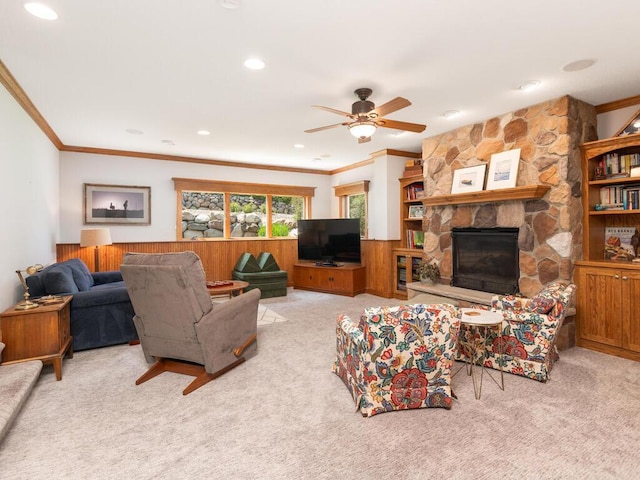 1776 Lockridge Ct, Waconia, MN 55387 - carpeted living room featuring ornamental molding, a stone fireplace, a ceiling fan, recessed lighting, and wood walls