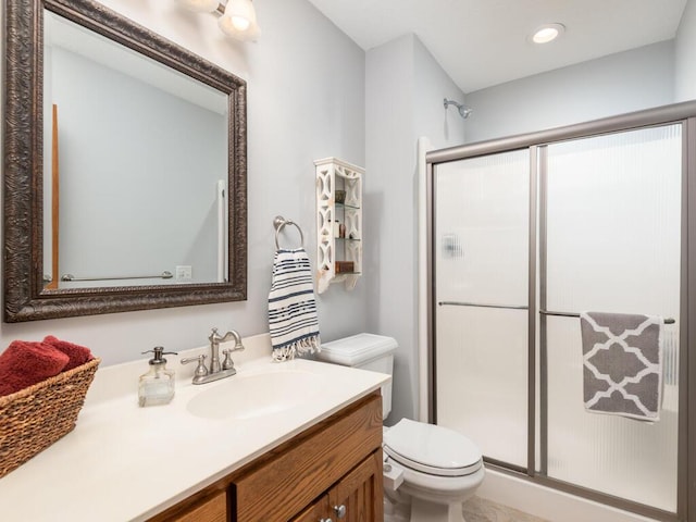 1776 Lockridge Ct, Waconia, MN 55387 - bathroom with toilet, a shower stall, vanity, and recessed lighting