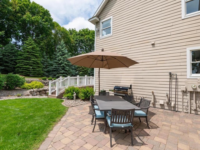 1776 Lockridge Ct, Waconia, MN 55387 - view of patio / terrace with a grill, outdoor dining area, and a wooden deck