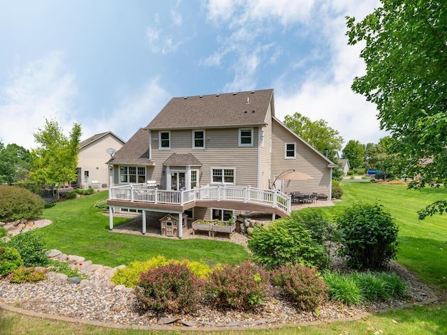 1776 Lockridge Ct, Waconia, MN 55387 - back of property with a wooden deck, a lawn, and roof with shingles