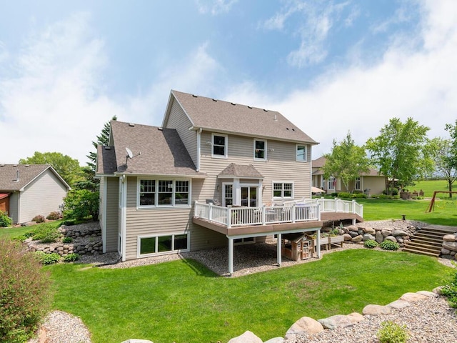 1776 Lockridge Ct, Waconia, MN 55387 - rear view of house with a wooden deck, a lawn, and a shingled roof