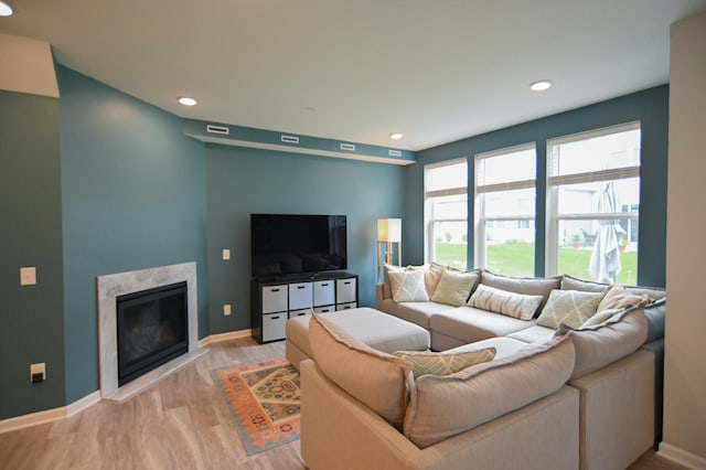 4837 Avery Ct, Eagan, MN 55123 - living room with light wood-type flooring, a high end fireplace, and recessed lighting