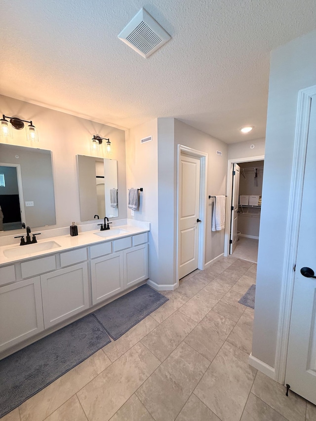 4837 Avery Ct, Eagan, MN 55123 - bathroom with double vanity and a textured ceiling