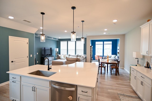 4837 Avery Ct, Eagan, MN 55123 - kitchen with stainless steel dishwasher, open floor plan, recessed lighting, light wood-type flooring, and pendant lighting