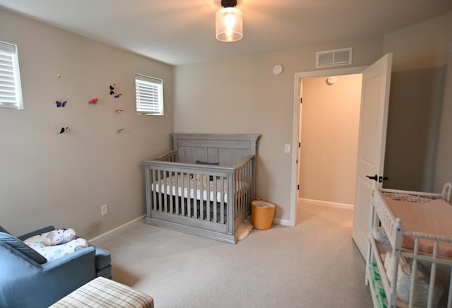4837 Avery Ct, Eagan, MN 55123 - bedroom with carpet flooring and a crib