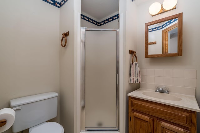 957 Belvista Dr, North Mankato, MN 56003 - full bathroom featuring tasteful backsplash, a shower stall, toilet, and vanity