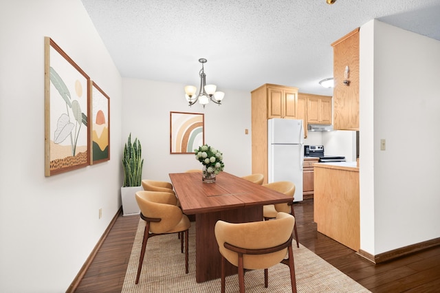 2800 Hillsboro Ave N Unit 214, New Hope, MN 55427 - dining space with a chandelier, dark wood finished floors, and a textured ceiling
