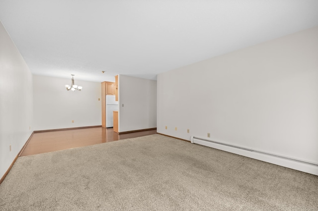 2800 Hillsboro Ave N Unit 214, New Hope, MN 55427 - carpeted empty room featuring a chandelier and baseboard heating