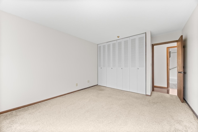 2800 Hillsboro Ave N Unit 214, New Hope, MN 55427 - unfurnished bedroom featuring carpet flooring and a closet