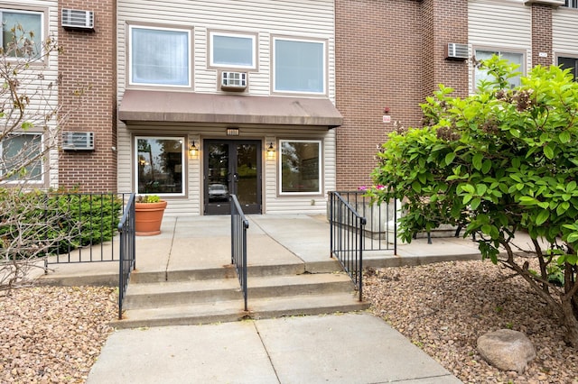 2800 Hillsboro Ave N Unit 214, New Hope, MN 55427 - entrance to property featuring french doors and a wall unit AC
