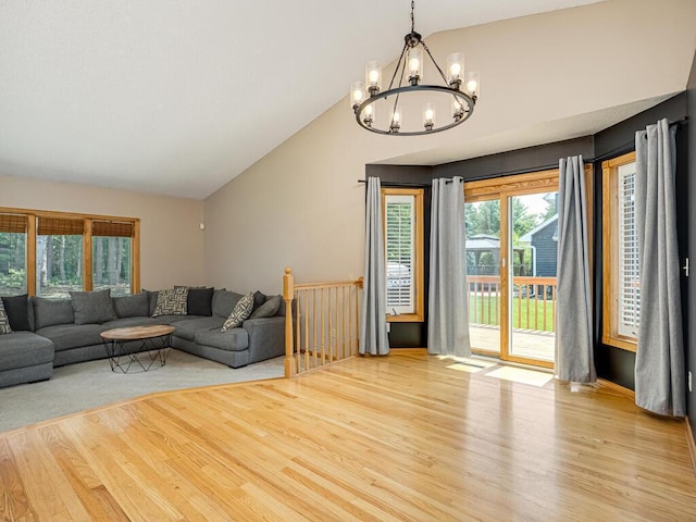 5956 Norway Pine Ct, White Bear Twp, MN 55110 - living room with a chandelier, wood finished floors, and high vaulted ceiling