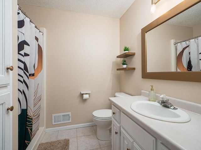 5956 Norway Pine Ct, White Bear Twp, MN 55110 - bathroom with vanity, toilet, a textured ceiling, tile patterned flooring, and baseboards