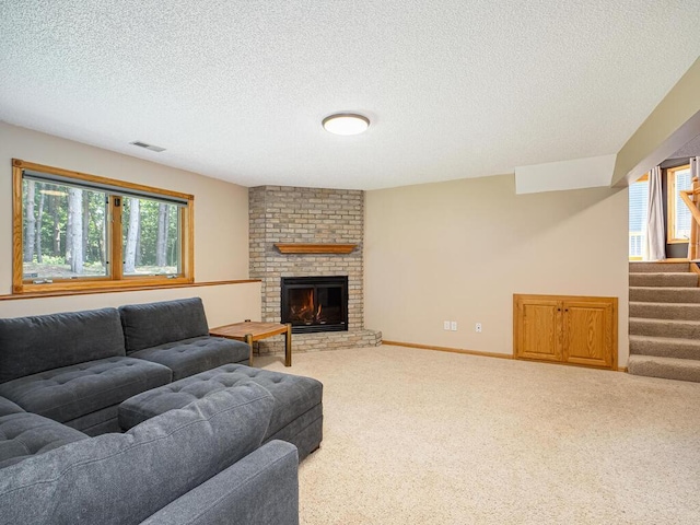 5956 Norway Pine Ct, White Bear Twp, MN 55110 - carpeted living room featuring plenty of natural light, stairway, a textured ceiling, a fireplace, and baseboards