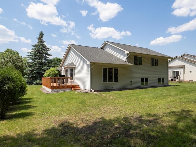 5956 Norway Pine Ct, White Bear Twp, MN 55110 - back of house featuring a wooden deck, a yard, and a shingled roof