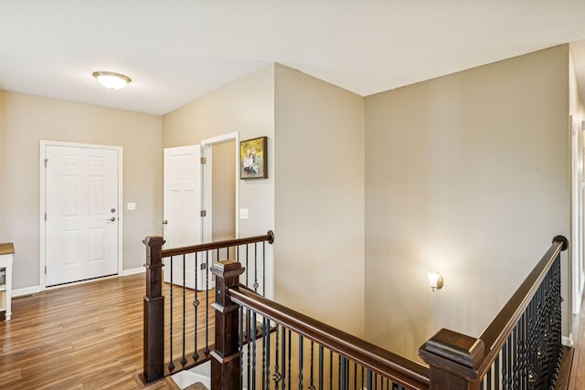 12083 79th St NE, Otsego, MN 55330 - hallway featuring an upstairs landing, wood finished floors, and baseboards