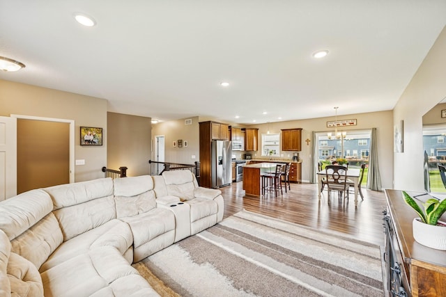 12083 79th St NE, Otsego, MN 55330 - living area featuring a chandelier, light wood-style floors, and recessed lighting