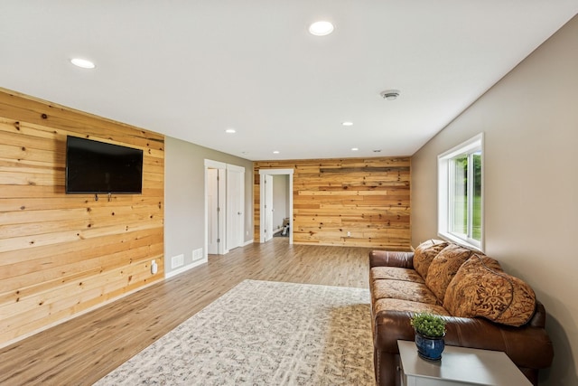 12083 79th St NE, Otsego, MN 55330 - living area with wooden walls, recessed lighting, wood finished floors, and baseboards