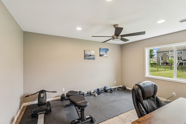 12083 79th St NE, Otsego, MN 55330 - exercise room with ceiling fan, baseboards, recessed lighting, wood finished floors, and a textured ceiling