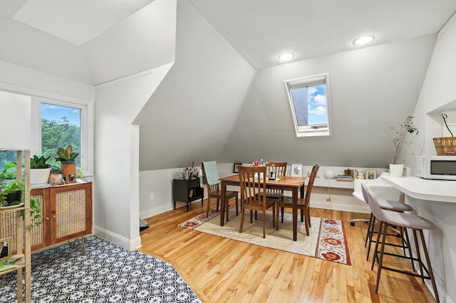 2516 Humboldt Ave S, Minneapolis, MN 55405 - dining space featuring vaulted ceiling, wood finished floors, and recessed lighting