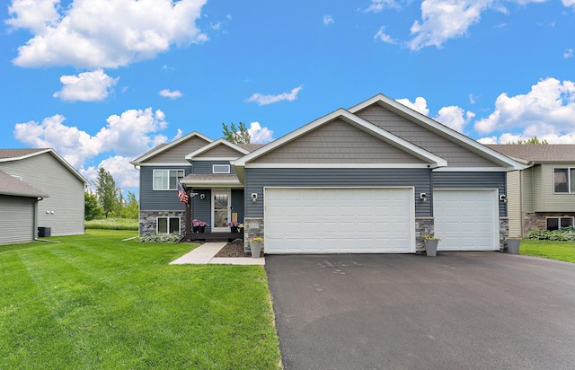 809 Cologne Ln, Waverly, MN 55390 - view of front of home with stone siding, driveway, a garage, and a front lawn