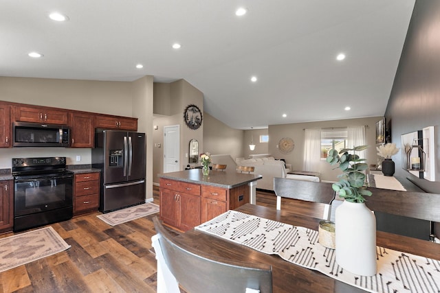 809 Cologne Ln, Waverly, MN 55390 - kitchen with stainless steel microwave, electric range, refrigerator with ice dispenser, vaulted ceiling, and dark countertops
