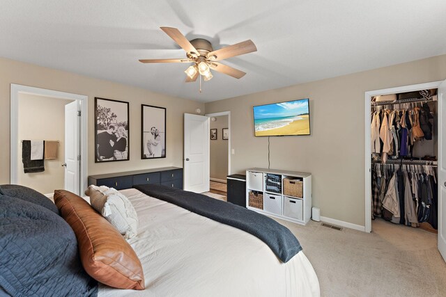 809 Cologne Ln, Waverly, MN 55390 - carpeted bedroom featuring a walk in closet, a closet, ceiling fan, and connected bathroom