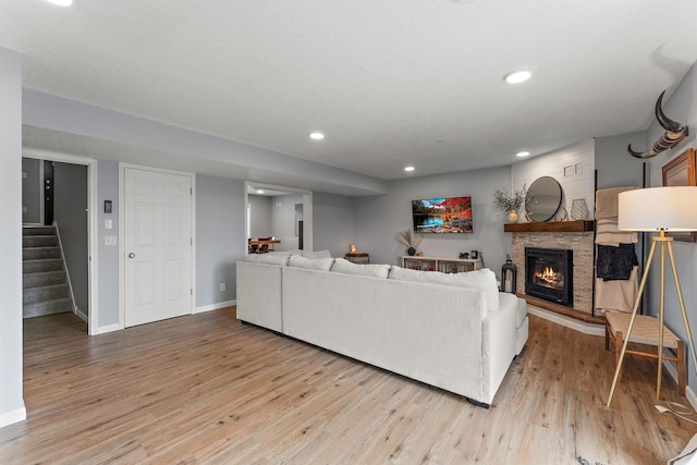 809 Cologne Ln, Waverly, MN 55390 - living area with light wood finished floors, a fireplace, stairway, and recessed lighting