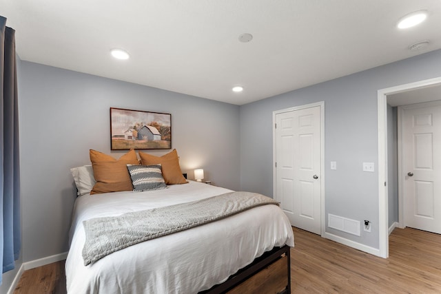 809 Cologne Ln, Waverly, MN 55390 - bedroom featuring light wood-style flooring and recessed lighting