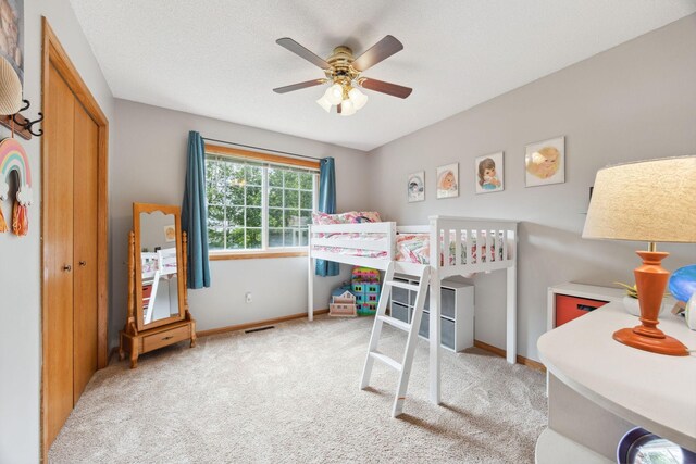 1590 Fountain Ln, Waconia, MN 55387 - bedroom with carpet, a ceiling fan, and a closet