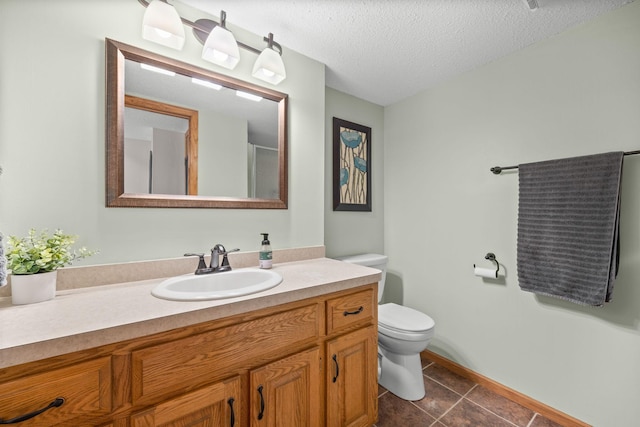 1590 Fountain Ln, Waconia, MN 55387 - bathroom featuring vanity, tile patterned floors, and a textured ceiling