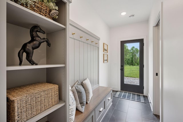 11278 Eastwood Ave SE, Delano, MN 55328 - mudroom featuring dark tile patterned floors and baseboards
