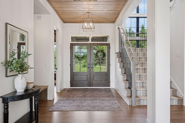 11278 Eastwood Ave SE, Delano, MN 55328 - foyer with french doors, stairs, wood ceiling, and dark wood-type flooring